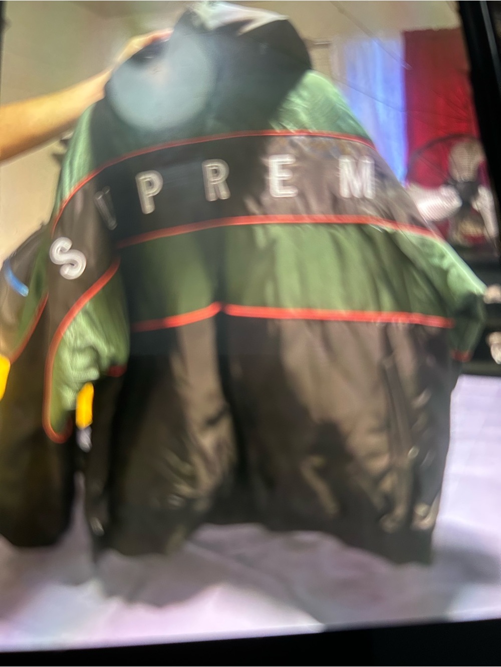 Supreme Black and Green Puffer Jacket with Red Trim
